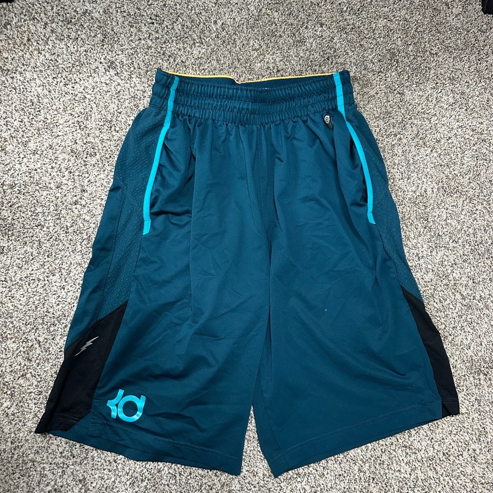 Nike Blue and Black Athletic Shorts with Elastic Waistband and Knee-Length Fit